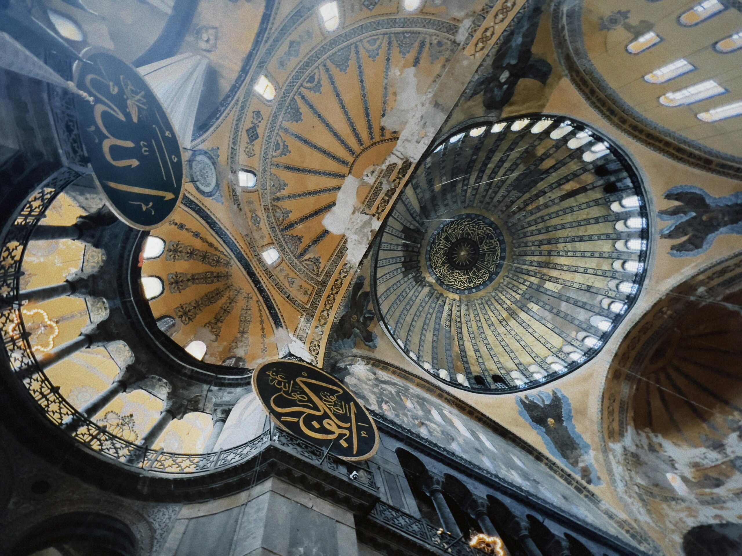 View of the magnificent dome and intricate details inside Hagia Sophia.